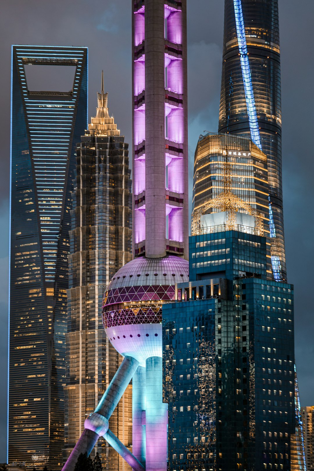 Home modern-skyscrapers-illuminated-at-night-in-a-city-jnkc-1oyxxq
